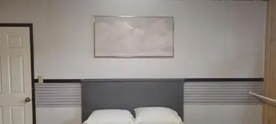 a bed with two white pillows on top of it at WhiteCourt in Abbotsford