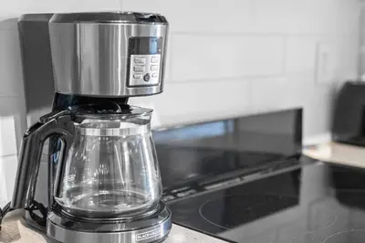 a blender sitting on a counter next to an oven at Boutique-Style Studio Unit in Edmonton