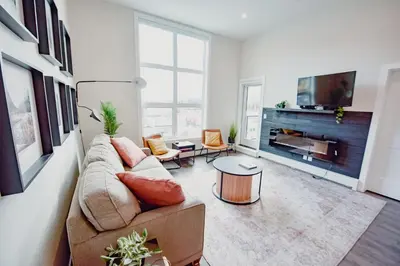 a living room with a couch and a fireplace at New Vaulted Ceilings 3 Beds AC Views in Golden