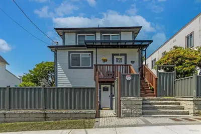 a house with a fence and a gate at Top choice 2-Bed 1-Bath Garden Suite in New Westminster