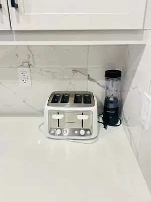 a toaster sitting on a shelf next to a blender at Relax at The Hills at Ellerslie in Edmonton
