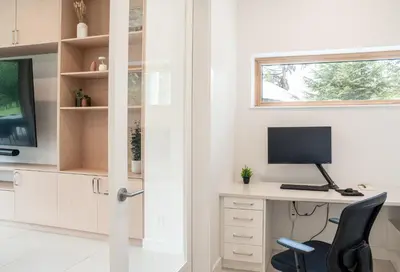 a home office with a desk and a computer at Camozzi Chalet by Revelstoke Vacations in Revelstoke