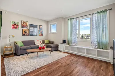 a living room with a couch and a window at Luxe & Lake 6BR Getaway Hot Tub Near the Lake in Sylvan Lake