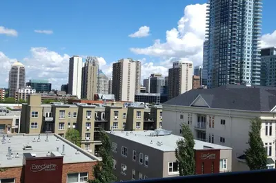 a view of a city skyline with tall buildings at YYC : 2-Bedroom City Apartment in Calgary