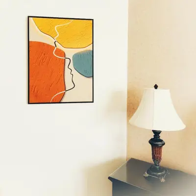a lamp on a table with a painting on the wall at Entire 6BED house easy to Banff & DT, Winsport in Calgary