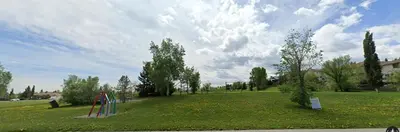 a park with a playground in the middle of a field at Entire 6BED house easy to Banff & DT, Winsport in Calgary