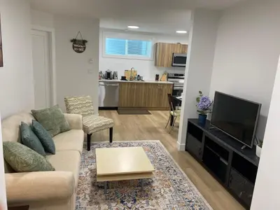 a living room with a couch and a tv at Oceanside 2 Bedroom Suite in Royal Bay-Free Nespresso Coffee with Welcome Treats in Colwood