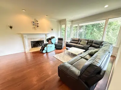 a living room with a couch and a fireplace at Luxuary Stay in West Vancouver in West Vancouver