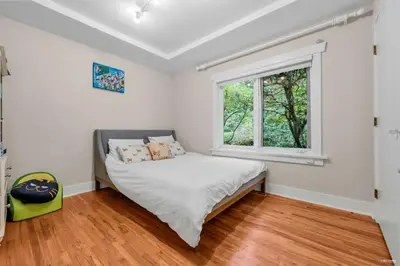 a bedroom with a bed and a window at Luxuary Stay in West Vancouver in West Vancouver