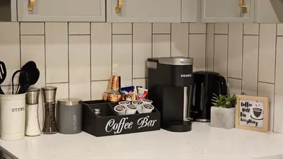 a coffee station on a counter with a coffeemaker at Modern Suite - Separate Entry - Self Check-In in Calgary