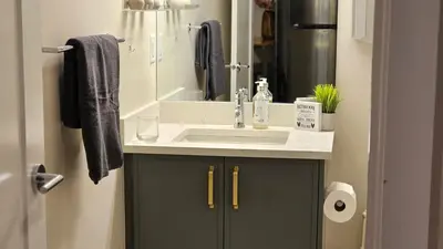 a bathroom with a sink and a mirror at Modern Suite - Separate Entry - Self Check-In in Calgary