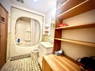 a small bathroom with a toilet and a sink at Beautiful and cozy room in Vancouver in Vancouver