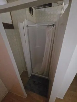 a bathroom with a shower with a shower curtain at Coal Branch Hotel & Restaurant