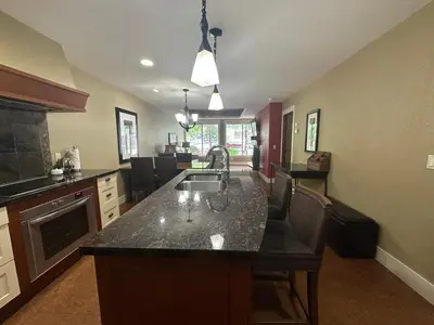 a kitchen with a sink and a counter top at Solara 2BR Retreat - Pool - Hot Tub & Resort Perks in Canmore