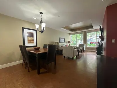 a dining room with a table and chairs at Solara 2BR Retreat - Pool - Hot Tub & Resort Perks in Canmore