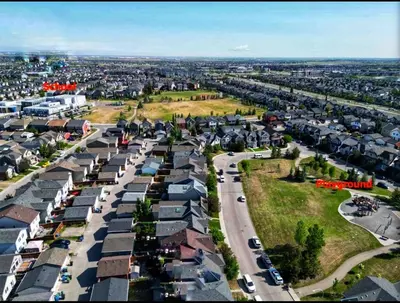an aerial view of a city with houses and cars at New 1 bdr basement apartment in Calgary