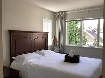 a bedroom with a large bed with a basket on it at Vancouver Richmond Villa 33 in Richmond