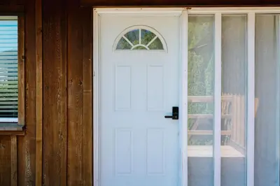 a white door with a window on a house at Serene 3BR Cabin on 8 Acre Farm in Mission City