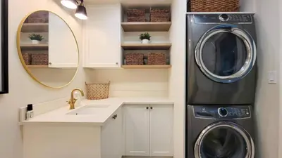 a laundry room with a washer and dryer at Bright 3-Bedroom Basement Suite with Separate Entrance in Burnaby