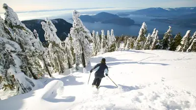 a person on skis in the snow on a mountain at Queens Suite in West Vancouver