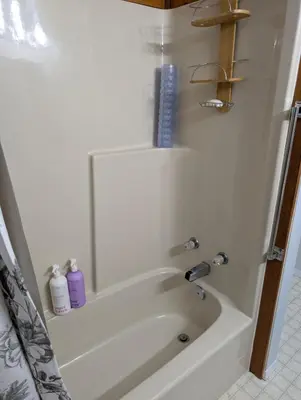 a bathroom with a bath tub with a sink at Alert Bay, Spacious Executive Suite with Panoramic Ocean Views in Alert Bay