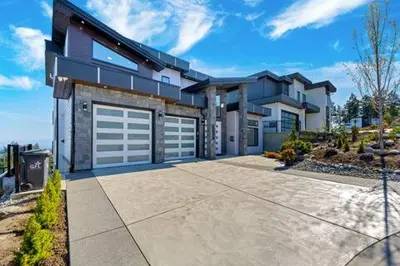 a large house with two garage doors on it at Luxury Home in Victoria