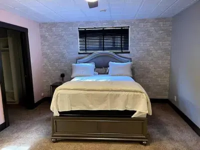 a bedroom with a large bed in a room at A Gorgeous Mansion for Jasper Vacation in Hinton