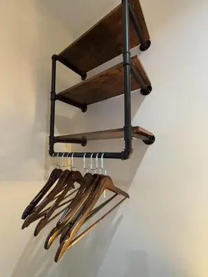 a rack of utensils hanging on a wall at Vancouver Mini Suite in Vancouver