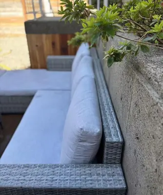 a planter on the side of a wall with a plant at Vancouver Mini Suite in Vancouver