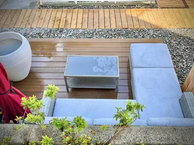 an overhead view of two blue couches on a patio at Vancouver Mini Suite in Vancouver