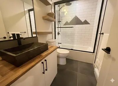 a bathroom with a black sink and a toilet at Cedar & Sage Suite the Cozy Retreat with Full Kitchen in Victoria