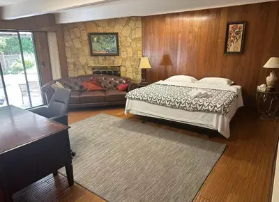 a bedroom with a bed and a couch at Cozy and spacious room near UBC-2 in Vancouver