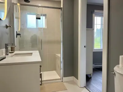 a bathroom with a shower and a sink at Sunshine garden 3 bedrooms2 bathrooms1 living room1 kitchen in Aldergrove