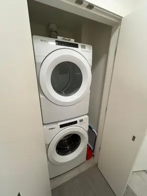 a washer and dryer in a small room at Victoria Colwood Place in Colwood