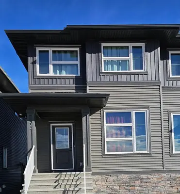 a house with a black door and windows at Family Friendly in Calgary