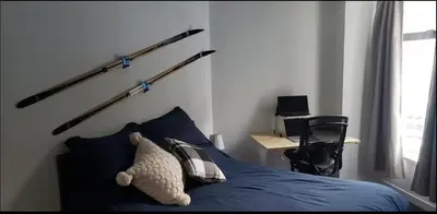 a bedroom with a bed with a stuffed animal on it at Quiet & Cozy Ski-In Out, Hot tub, pool in Whistler