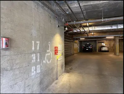 an empty parking garage with cars parked in it at Quiet & Cozy Ski-In Out, Hot tub, pool in Whistler