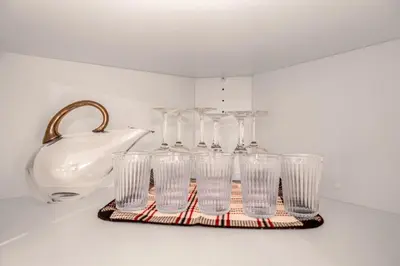 a group of glasses sitting on a tray next to a sink at Prestigious 2 Bedrooms 2 Baths in West Point Grey in Vancouver