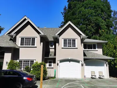 a house with a car parked in front of it at Eagle's House, Room #B in Victoria