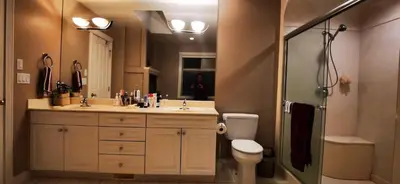 a bathroom with a toilet and a sink and a shower at Eagle's House, Room #B in Victoria