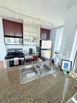 a kitchen with a sink and a counter top at Downtown,FreeParking,Pool,Comfy,OceanMontain View in Vancouver
