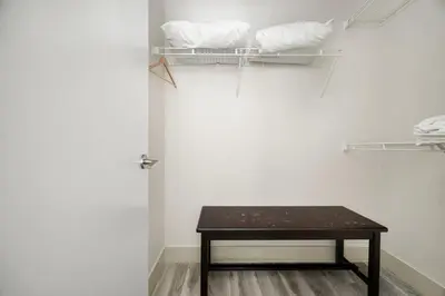 a small table in a room with a white wall at 2BR Suite with Scenic Views in Harrison Hot Springs