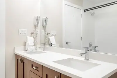 a bathroom with a sink and a mirror at 2BR Suite with Scenic Views in Harrison Hot Springs