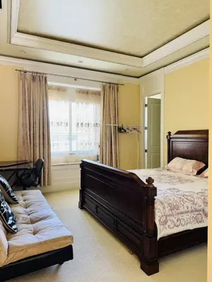 a large bedroom with a bed and a couch at Vancouver Richmond Villa 40 in Richmond