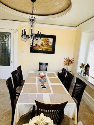 a dining room with a table and chairs at Vancouver Richmond Villa 40 in Richmond