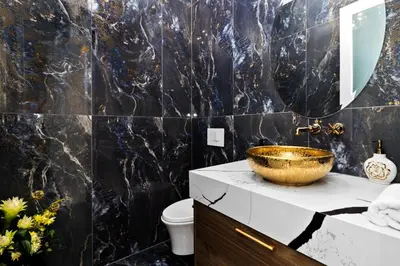 a bathroom with a gold bowl on a counter at Spacious 6BR Entire Home Sleeps 14 Private Parking Pet-Friendly Near Vancouver in Surrey