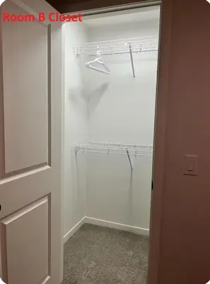 a room with a closet with white walls and a door at Affordable Cozy Bedroom Close to YYC Airport in Calgary