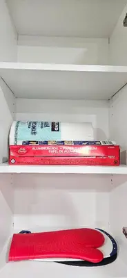 two red books are sitting on a shelf at 1 BR suite near WEM, with fast WiFi and Equipped kitchen in Edmonton