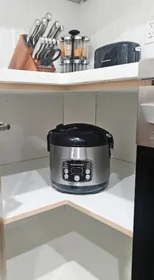 a slow cooker on a shelf in a kitchen at 1 BR suite near WEM, with fast WiFi and Equipped kitchen in Edmonton