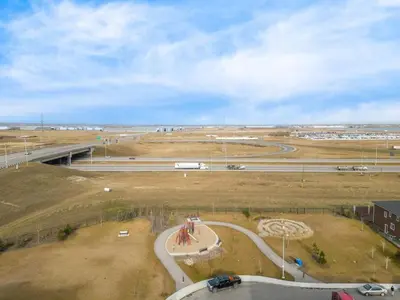 an aerial view of a race track in a field at Bright 2BR Suite Near YYC & Mall in Calgary